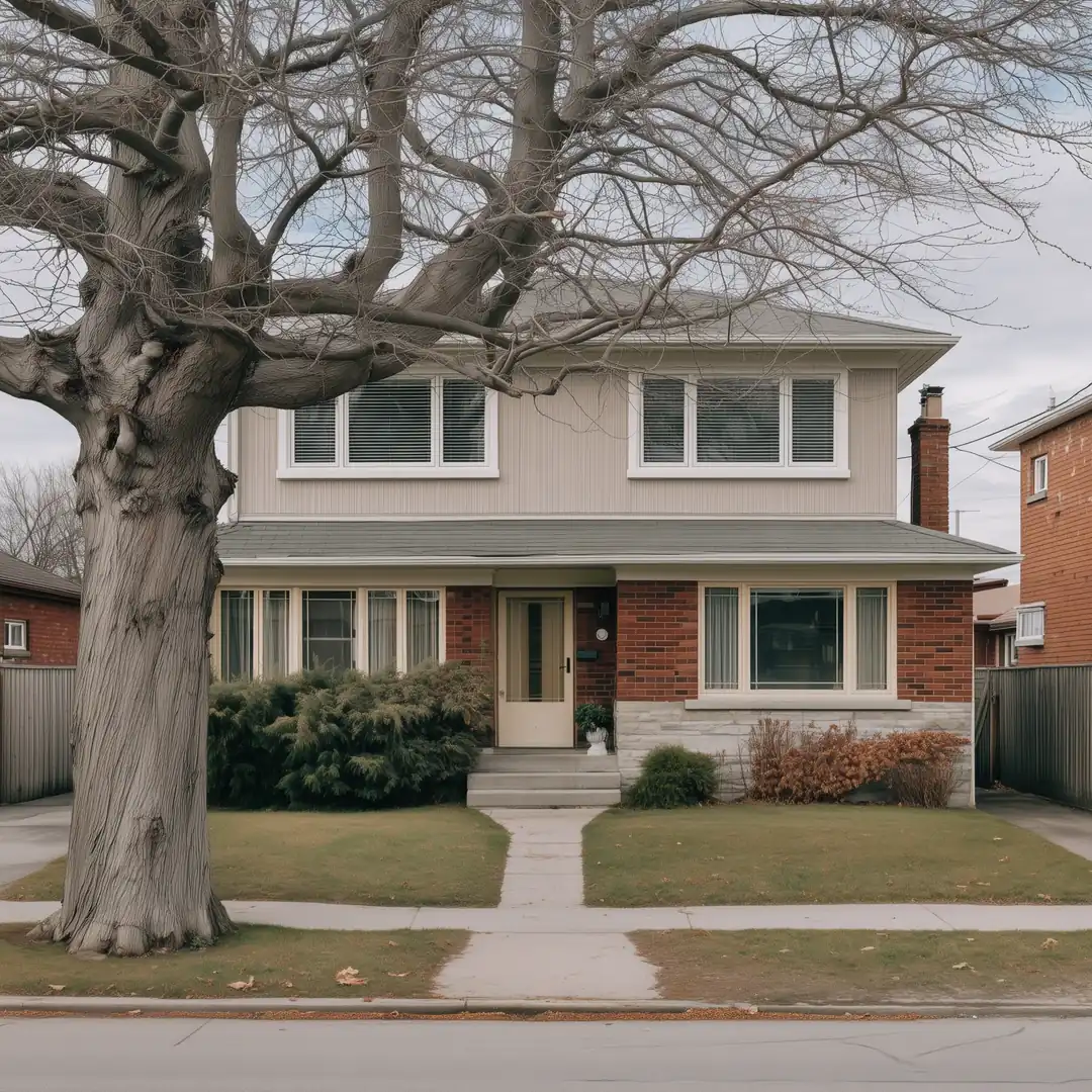 The same Toronto bungalow with a finished second storey, new roof, and new upstairs windows